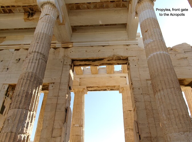 photo of large marble columns rising far above the camera, labeled "Propylea, front gate to the Acropolis"