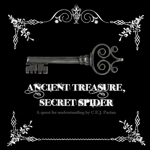 An ornate key in a vintage graphic frame.