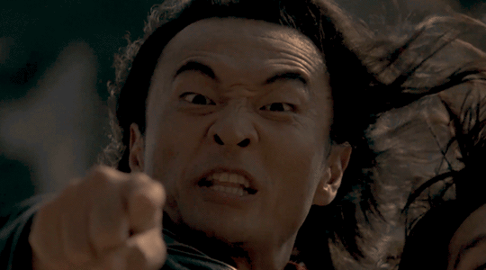 Cary-Hiroyuki Tagawa points angrily at the camera in one of the Mortal Kombat movies.